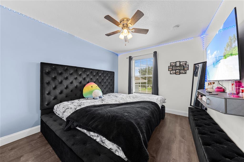 4301 Presidio Way Kissimmee, FL 34746 - Photo 29 of 50 a bed sitting in a bedroom next to a window