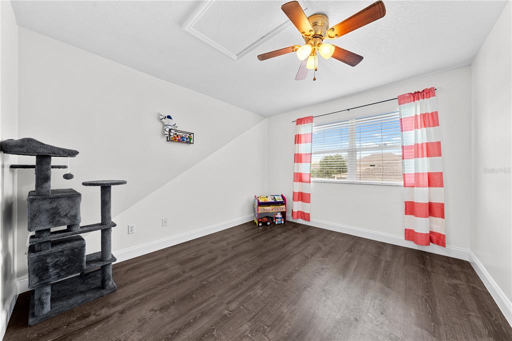 4301 Presidio Way Kissimmee, FL 34746 - Photo 30 of 50 a view of a room with gym equipment and wooden floor
