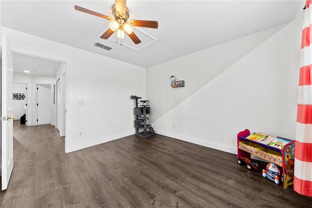 4301 Presidio Way Kissimmee, FL 34746 - Photo 31 of 50 a view of livingroom with hardwood floor and ceiling fan