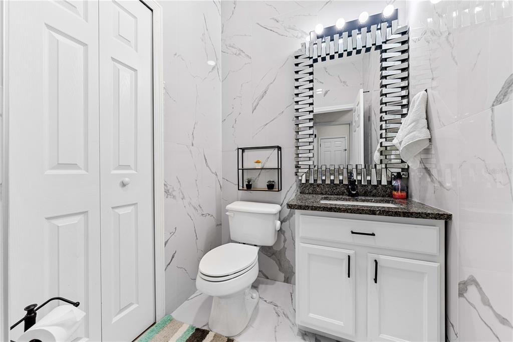 4301 Presidio Way Kissimmee, FL 34746 - Photo 34 of 50 a bathroom with a toilet a sink and a mirror