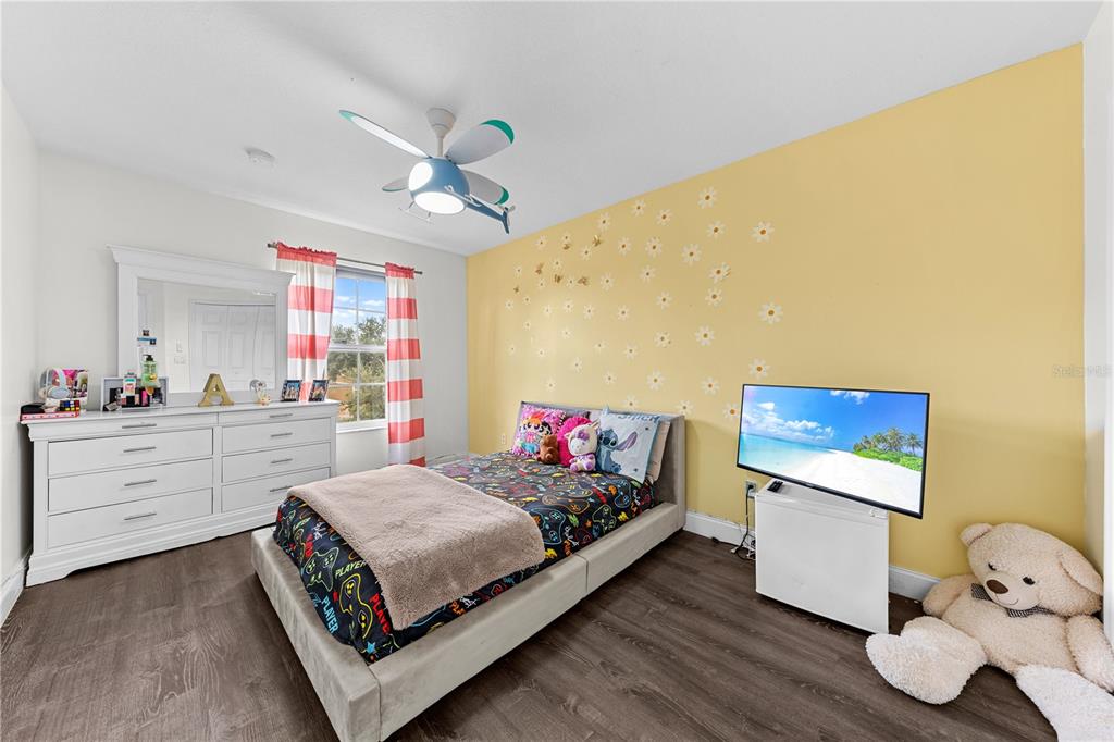 4301 Presidio Way Kissimmee, FL 34746 - Photo 36 of 50 a living room with furniture and a flat screen tv