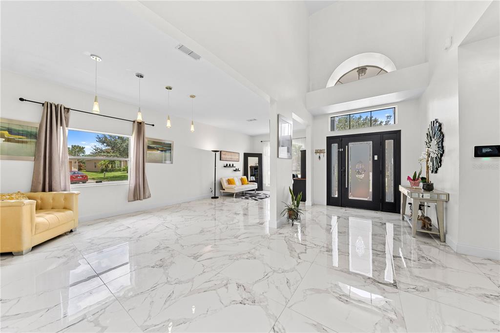 4301 Presidio Way Kissimmee, FL 34746 - Photo 9 of 50 a view of a hallway with furniture and a window