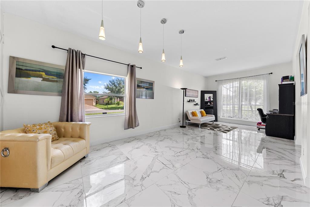 4301 Presidio Way Kissimmee, FL 34746 - Photo 10 of 50 a living room with furniture and a window