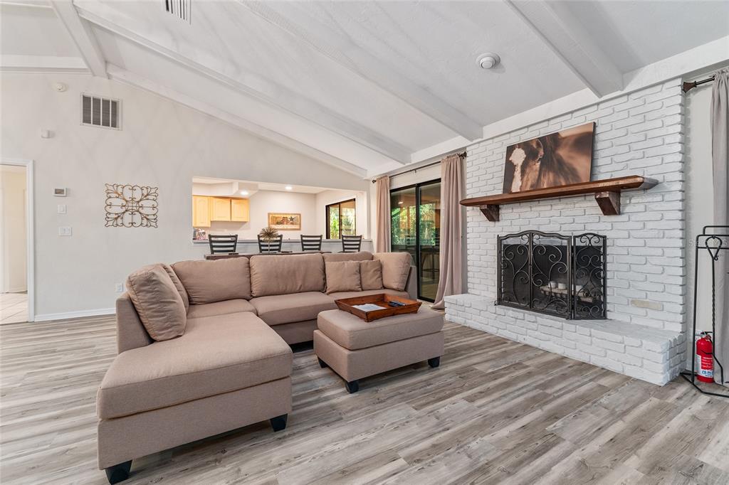 8101 Northwest 46th Street Ocala, FL 34482 - Photo 11 of 71 a living room with furniture and a fireplace