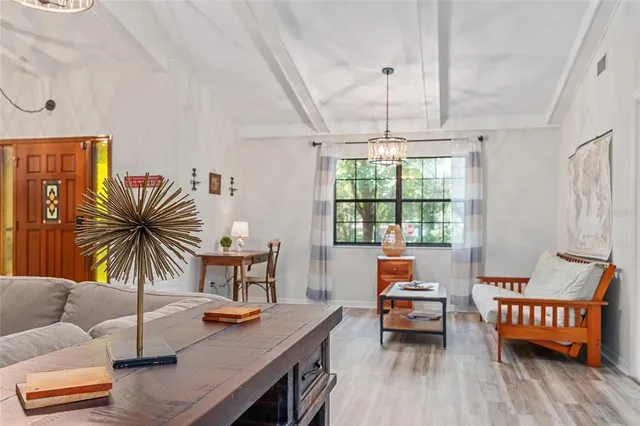 a kitchen with a chair and a large window