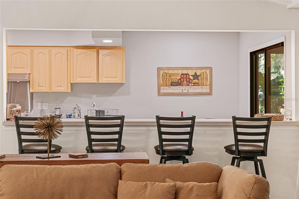 8101 Northwest 46th Street Ocala, FL 34482 - Photo 20 of 71 a kitchen with a chair and a large window