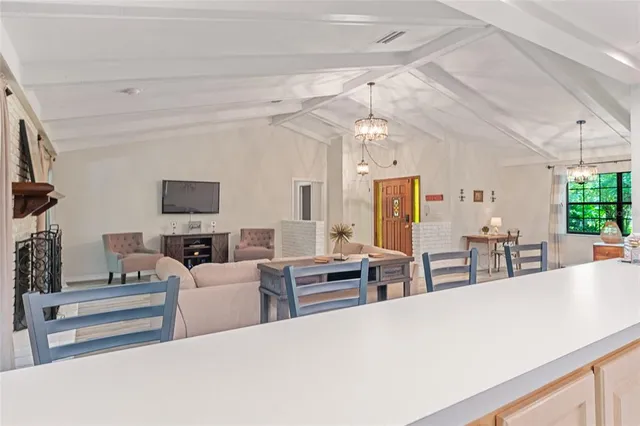 a bathroom with a sink and a mirror with bathtub