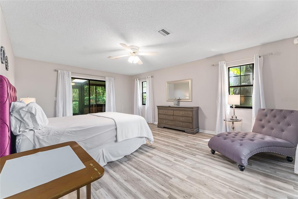 8101 Northwest 46th Street Ocala, FL 34482 - Photo 37 of 71 a spacious bedroom with a bed and window