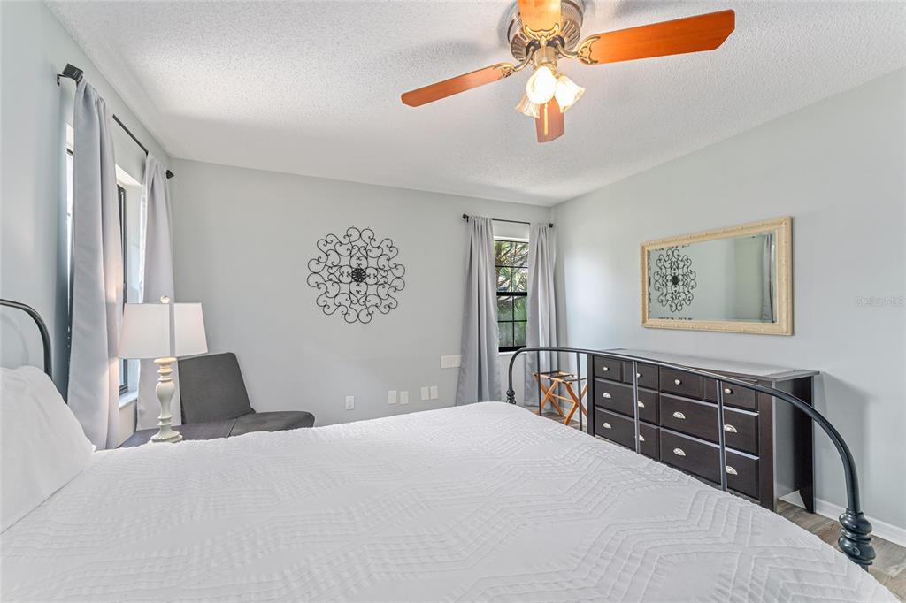 8101 Northwest 46th Street Ocala, FL 34482 - Photo 50 of 71 a bedroom with a bed and a chandelier