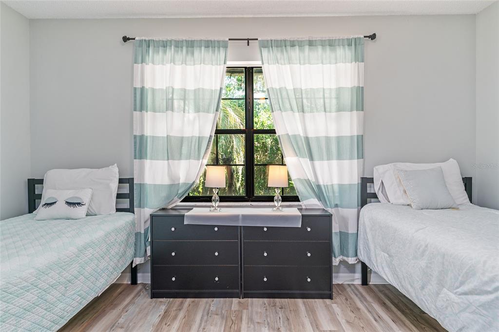 8101 Northwest 46th Street Ocala, FL 34482 - Photo 57 of 71 a bedroom with a bed and large windows