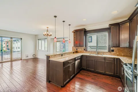 a kitchen with a sink and cabinets