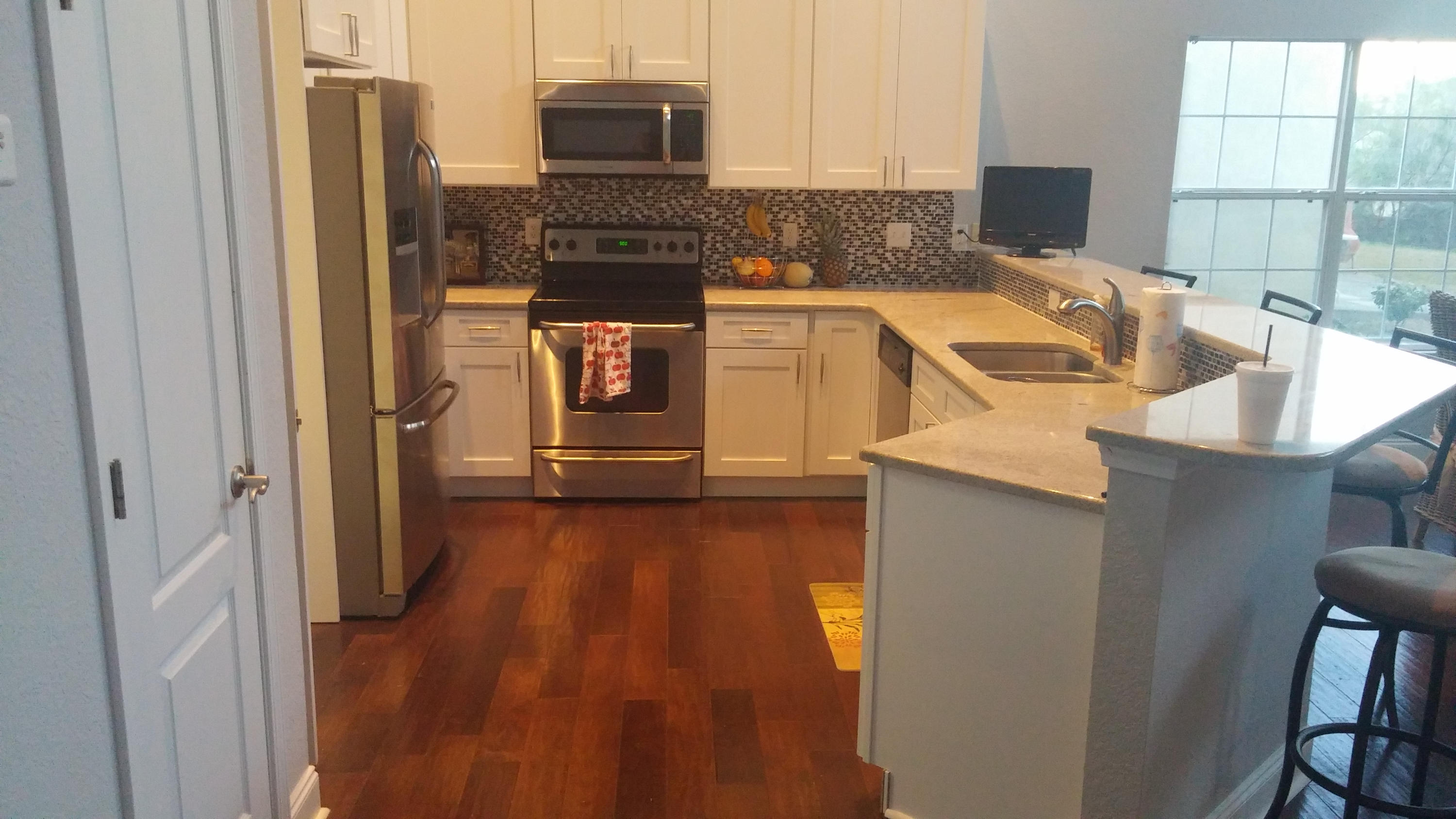 175 Loblolly Bay Drive Santa Rosa Beach, FL 32459 - Photo 5 of 11 a kitchen with stainless steel appliances granite countertop a refrigerator and a stove