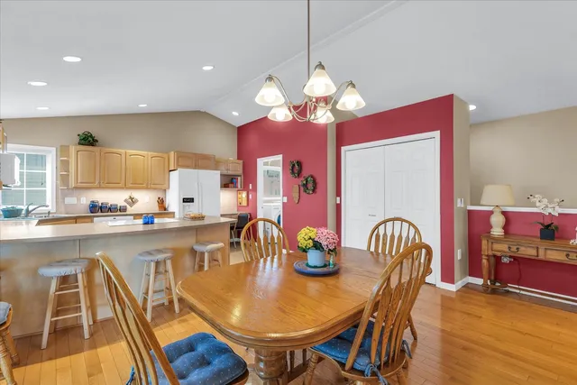 a kitchen with refrigerator and cabinets