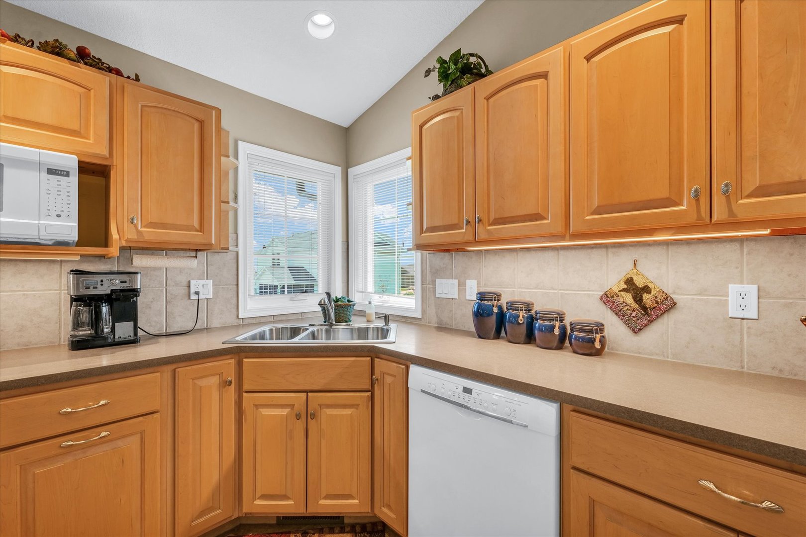 3204 Ridge Park Road Urbana, IL 61802 - Photo 18 of 56 a kitchen with stainless steel appliances granite countertop a sink a refrigerator and cabinets