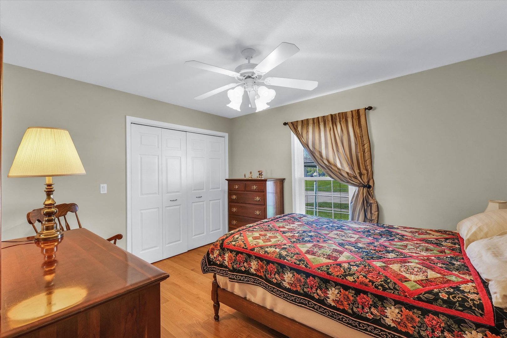 3204 Ridge Park Road Urbana, IL 61802 - Photo 22 of 56 a bedroom with a bed and a chandelier