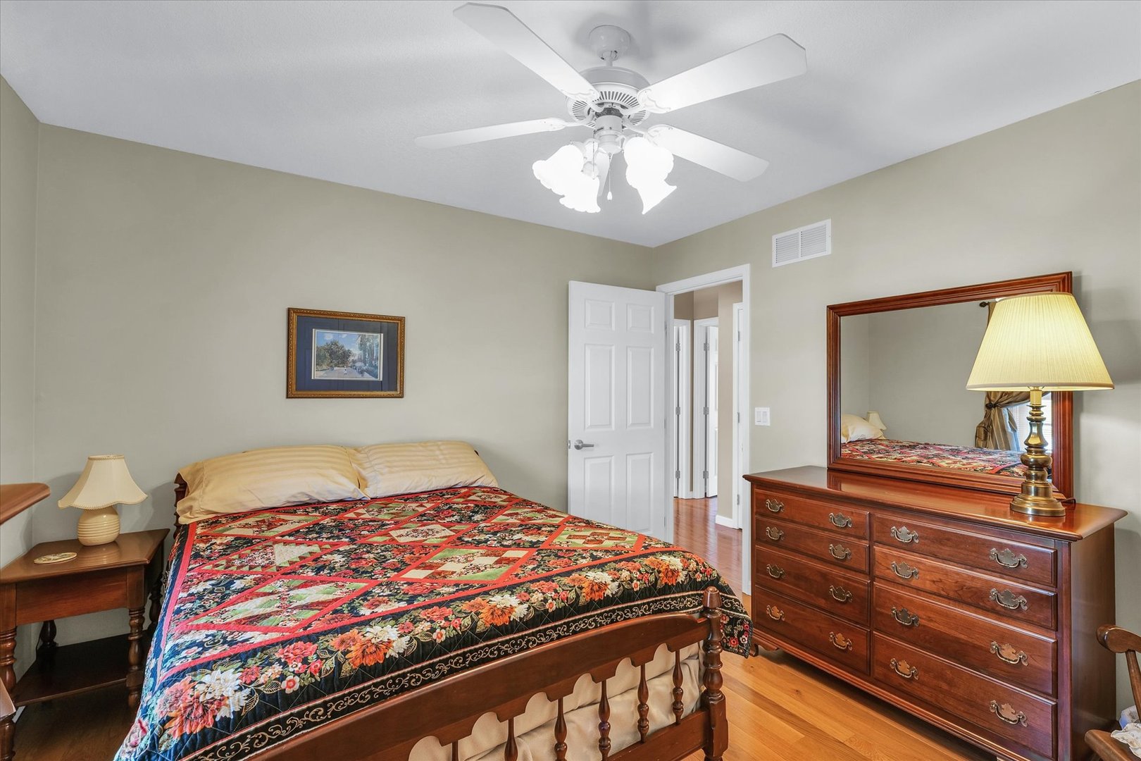 3204 Ridge Park Road Urbana, IL 61802 - Photo 23 of 56 a bedroom with a bed and a chandelier