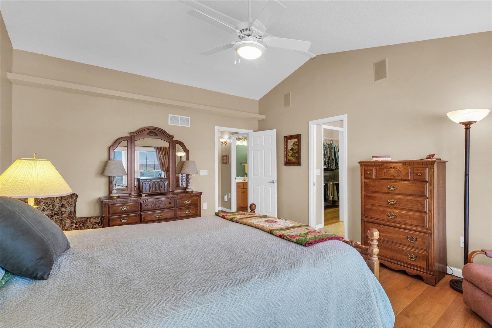 3204 Ridge Park Road Urbana, IL 61802 - Photo 29 of 56 a bedroom with a bed and a chandelier