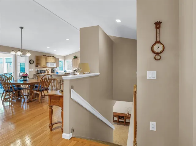 a living room with furniture a pool and a flat screen tv