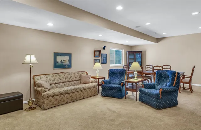 a bathroom with a granite countertop sink toilet a large mirror a vanity and shower
