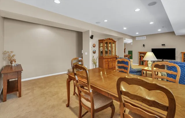 a view of a livingroom with workspace and a window
