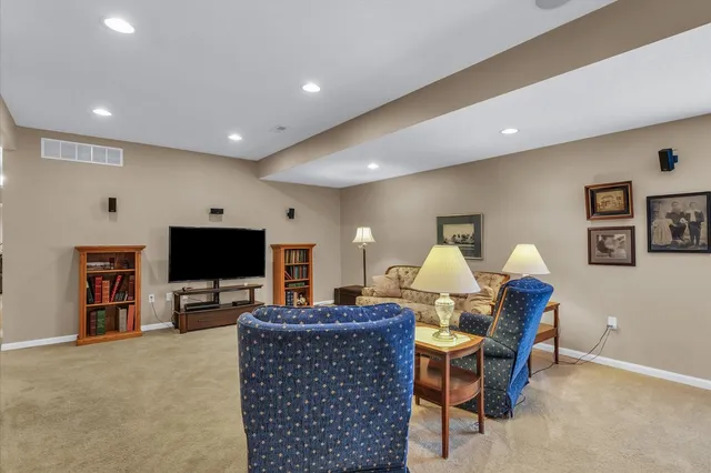 a view of a livingroom with workspace and a couch