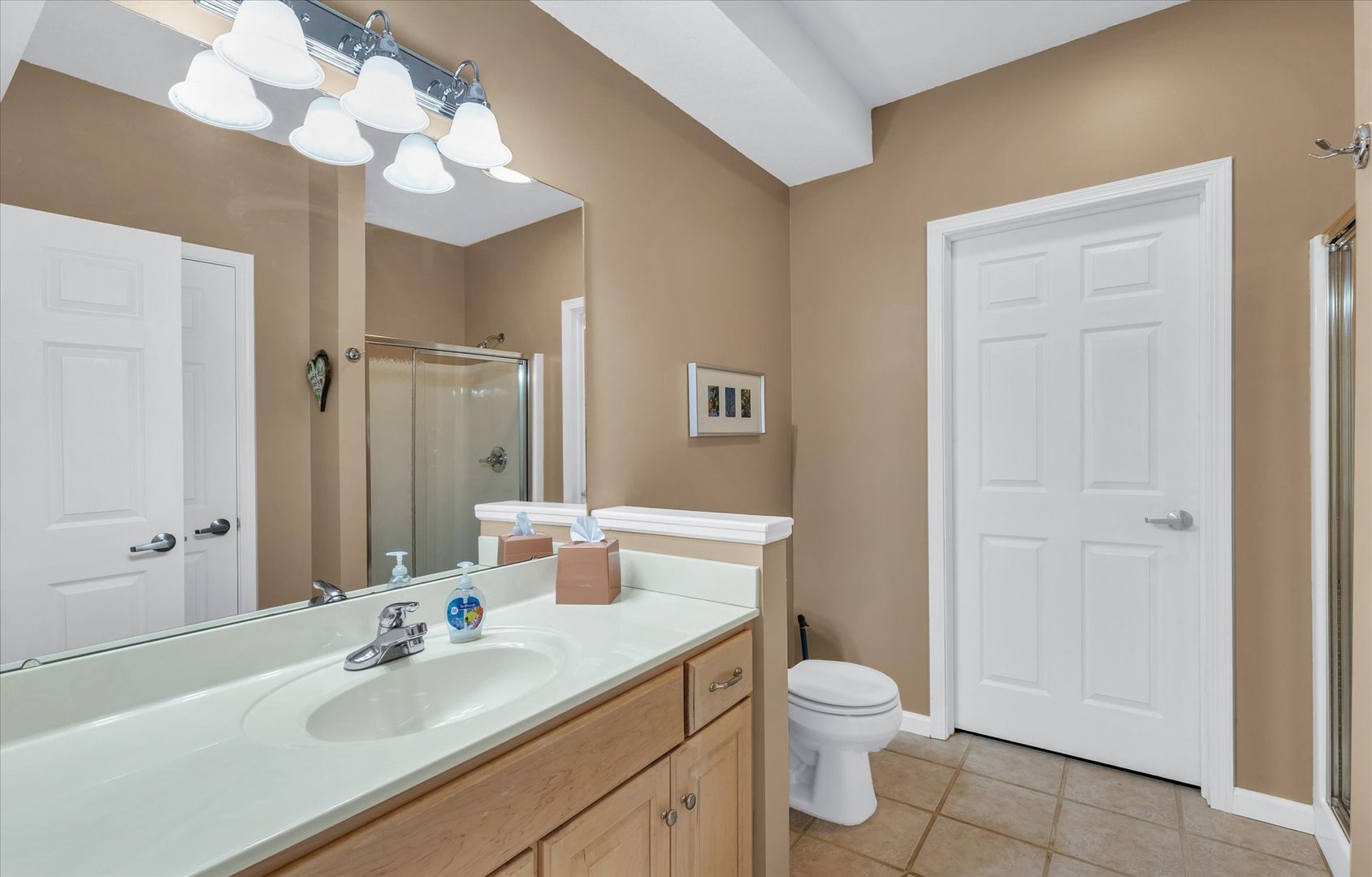 3204 Ridge Park Road Urbana, IL 61802 - Photo 43 of 56 a bathroom with a granite countertop sink toilet a large mirror a vanity and shower