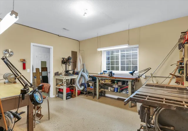 a view of a house with a yard porch and sitting area