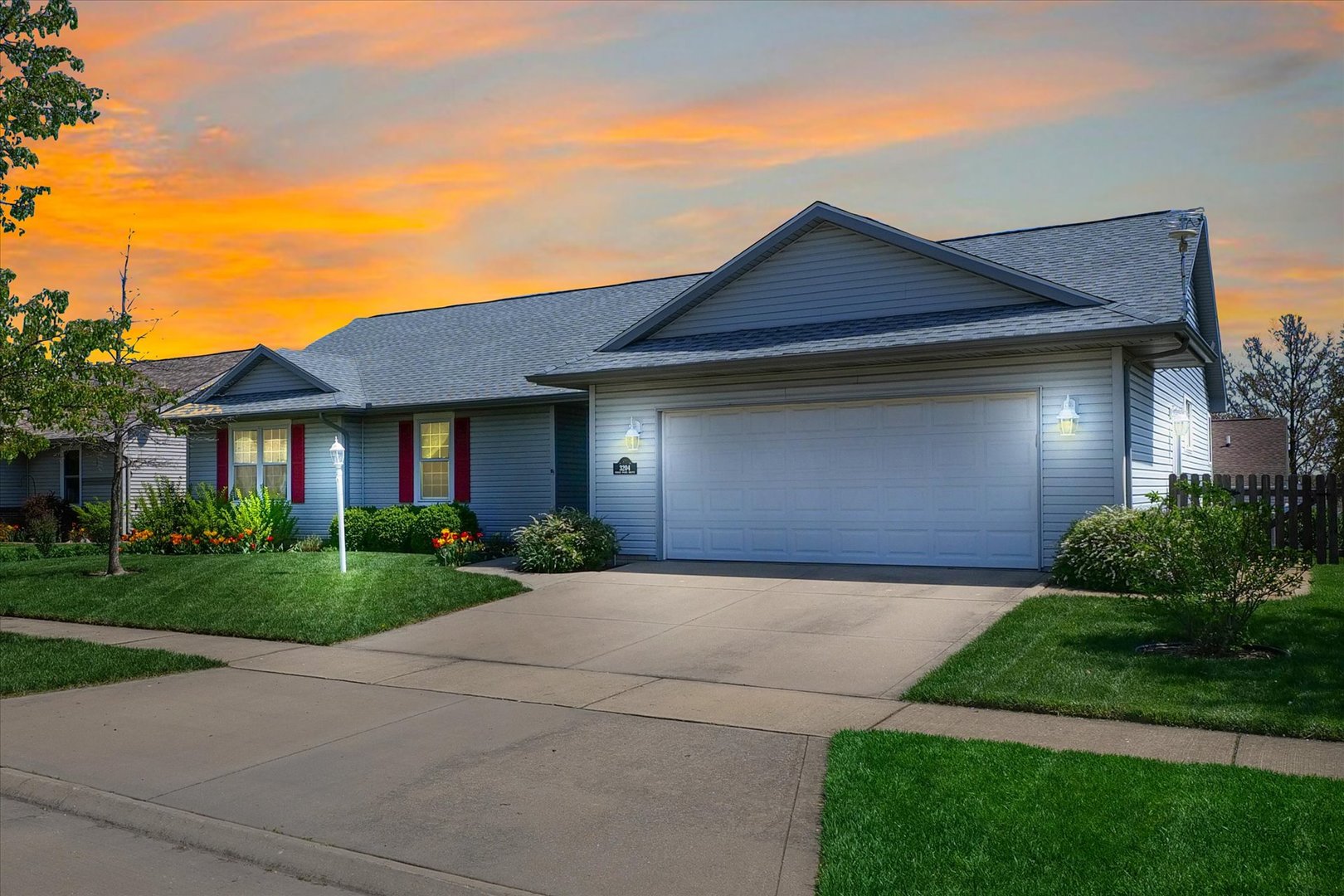 3204 Ridge Park Road Urbana, IL 61802 - Photo 55 of 56 a front view of a house with a yard and garage