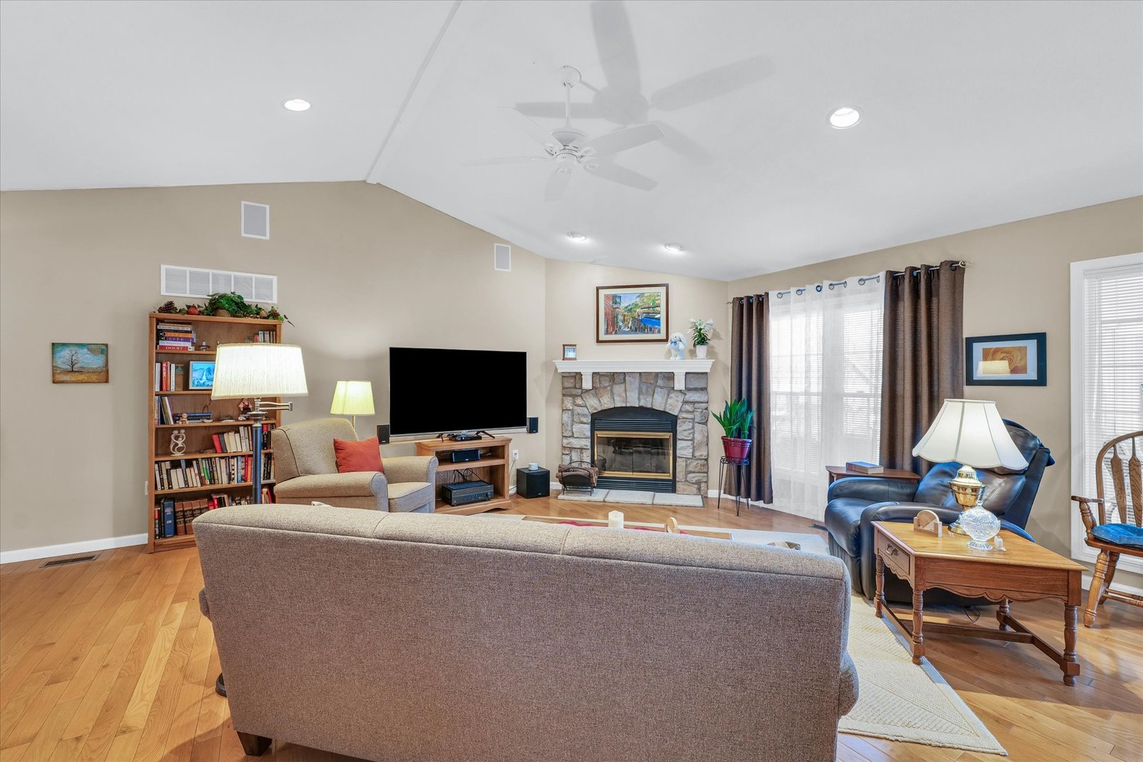 3204 Ridge Park Road Urbana, IL 61802 - Photo 8 of 56 a living room with furniture a fireplace and a flat screen tv