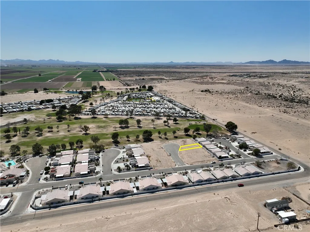 an aerial view of a house with a ocean view