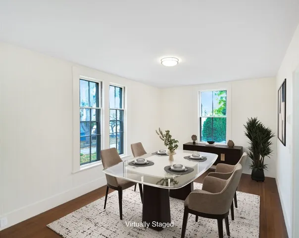 a view of a dining room with furniture and window