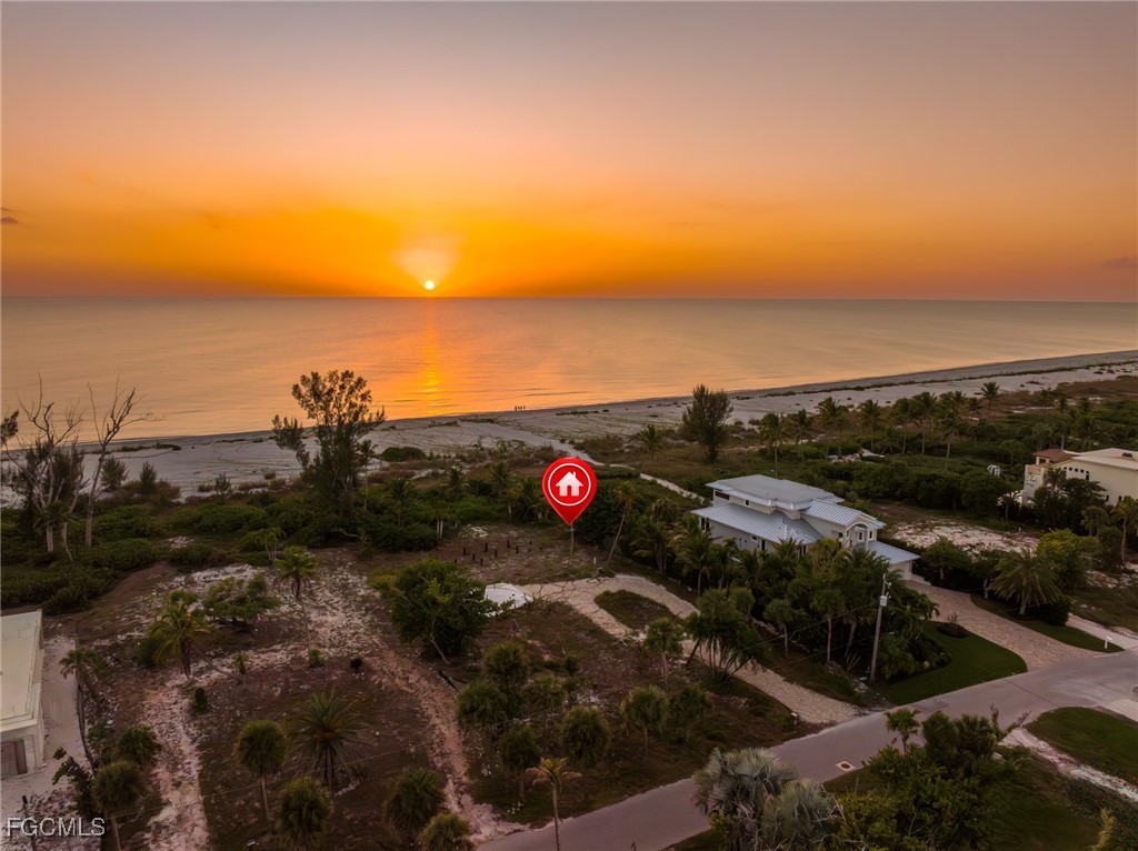 4641 Rue Belle Mer Sanibel, FL 33957 - Photo 7 of 10 a view of an ocean beach and city