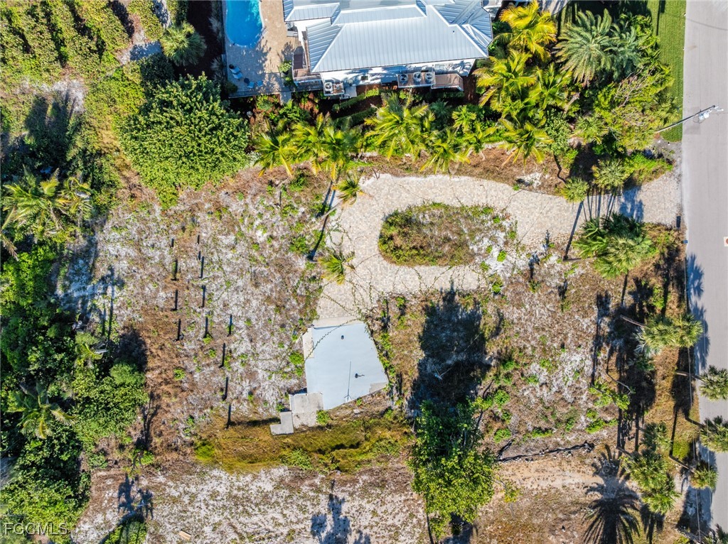 4641 Rue Belle Mer Sanibel, FL 33957 - Photo 9 of 10 a view of a garden with a fountain