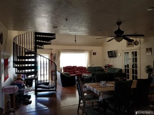 a livingroom with furniture window and wooden floor