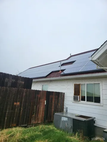 a view of house with backyard