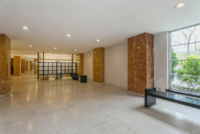 a view of a lobby with black carpet