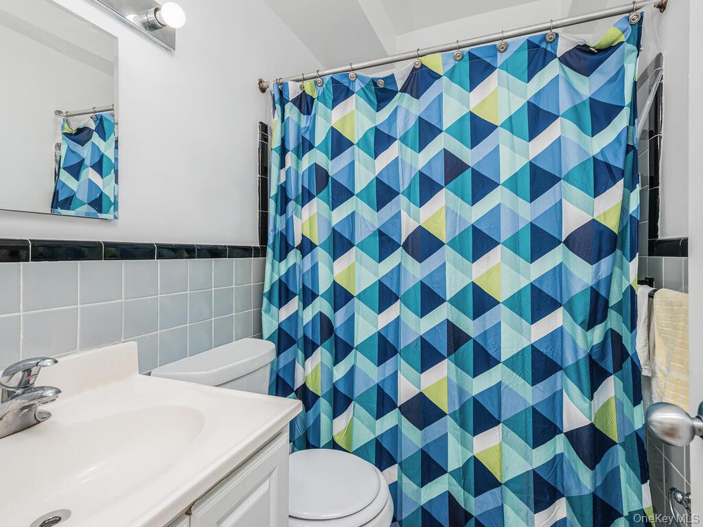 5500 Fieldston Road, Unit 5AA Bronx, NY 10471 - Photo 7 of 14 a bathroom with a sink and a mirror