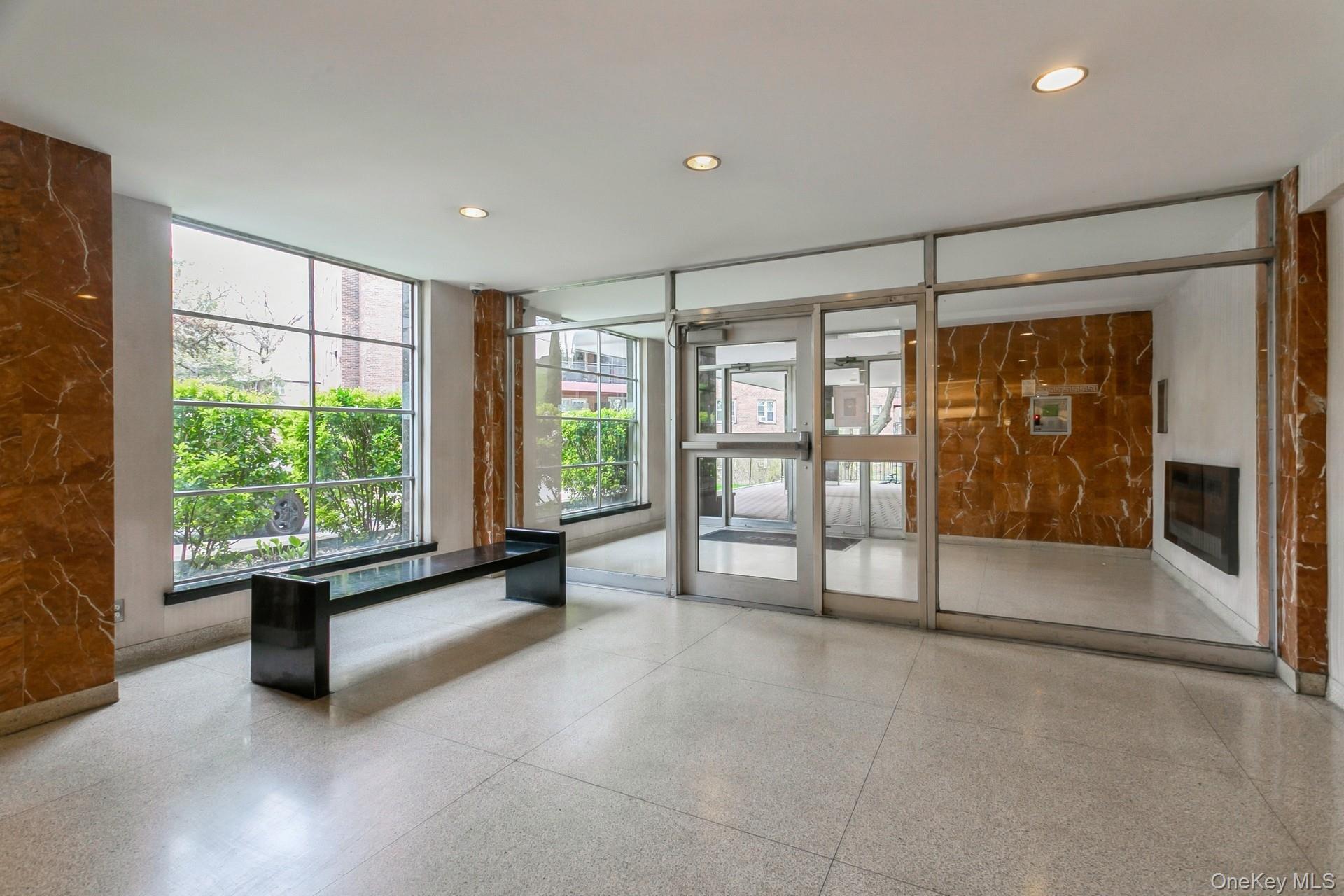 5500 Fieldston Road, Unit 5AA Bronx, NY 10471 - Photo 10 of 14 a living room with furniture and a large window