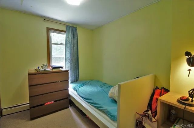 a room with a bed and a window