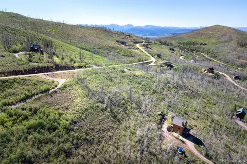 an aerial view of residential houses and outdoor space