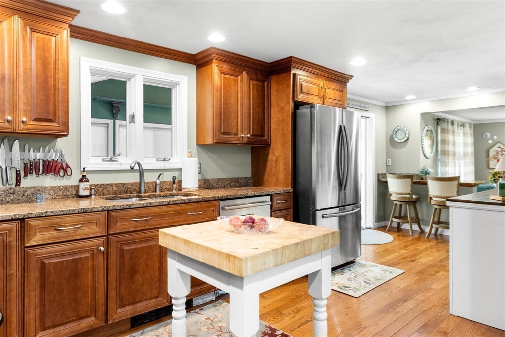 35 Memorial Drive Methuen, MA 01844 - Photo 11 of 42 a kitchen with a sink refrigerator and cabinets