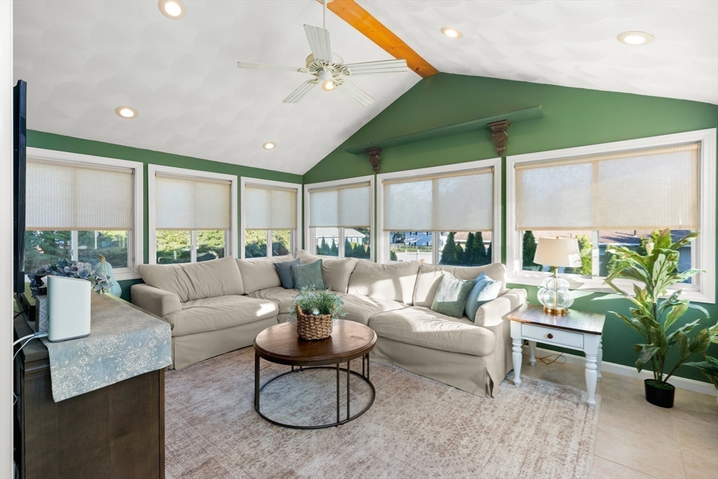 35 Memorial Drive Methuen, MA 01844 - Photo 14 of 42 a living room with furniture potted plant and a large window