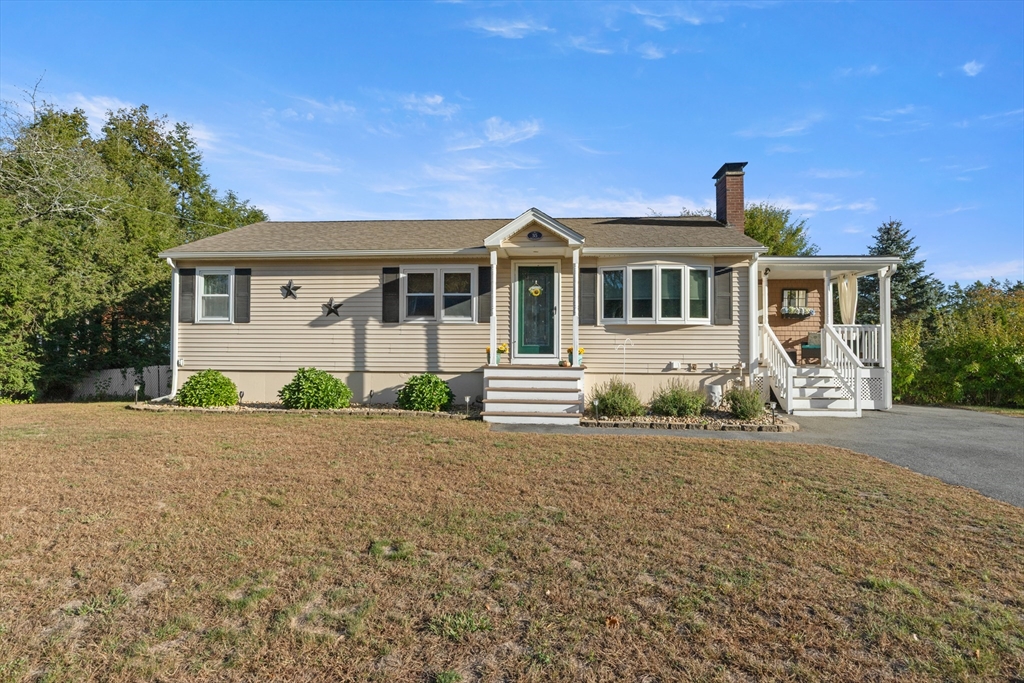 35 Memorial Drive Methuen, MA 01844 - Photo 2 of 42 front view of a house with a yard