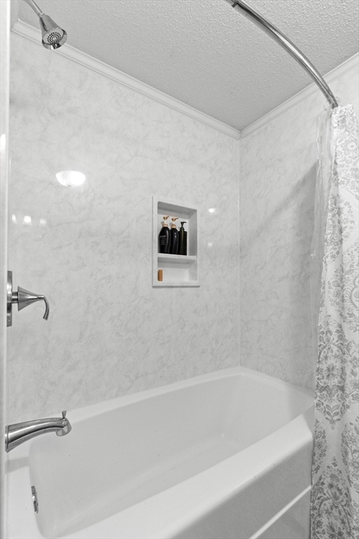 35 Memorial Drive Methuen, MA 01844 - Photo 21 of 42 a bathroom with a shower and a bath tub