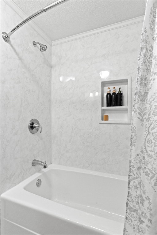 35 Memorial Drive Methuen, MA 01844 - Photo 22 of 42 a bathroom with a bathtub and shower