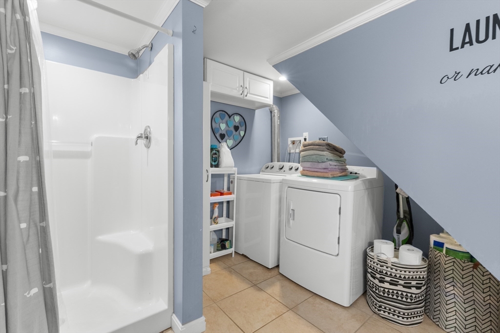 35 Memorial Drive Methuen, MA 01844 - Photo 29 of 42 a utility room with cabinets washer and dryer