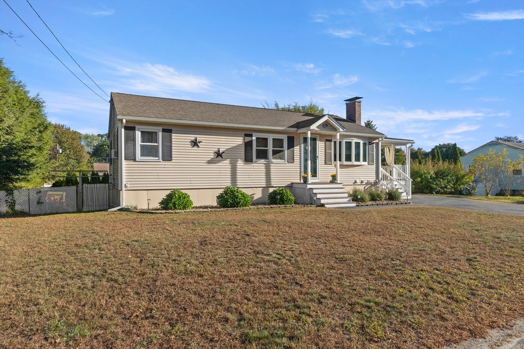 35 Memorial Drive Methuen, MA 01844 - Photo 3 of 42 a front view of a house with a yard and a garage