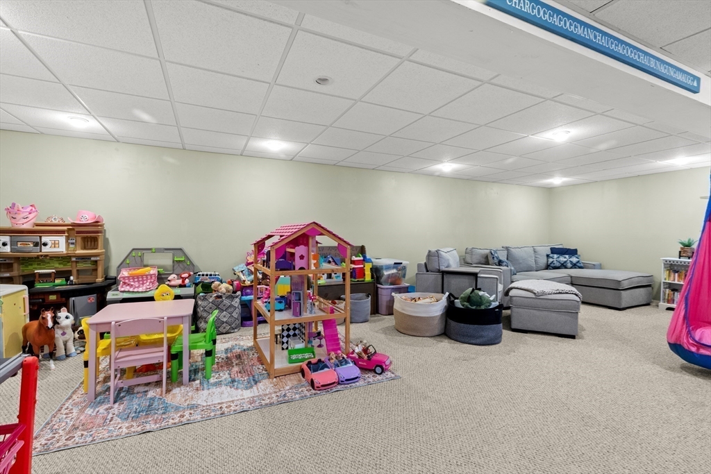 35 Memorial Drive Methuen, MA 01844 - Photo 31 of 42 a living room with lots of furniture and a dining table