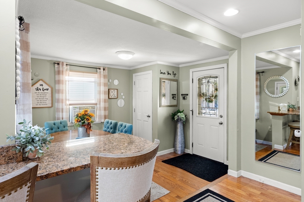 35 Memorial Drive Methuen, MA 01844 - Photo 5 of 42 a dining room with furniture and wooden floor