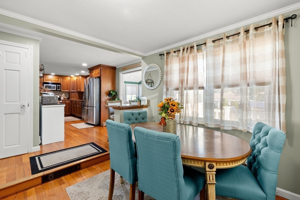 35 Memorial Drive Methuen, MA 01844 - Photo 6 of 42 a dining room with furniture and a floor to ceiling window